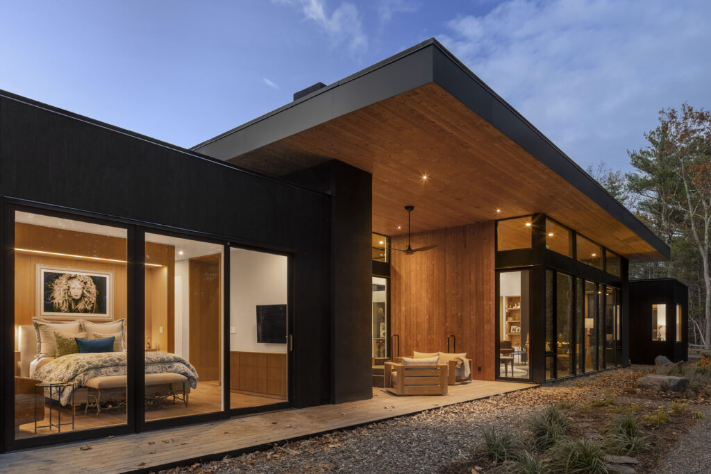 A view of Fermata showing the alignment between the roof and the other volumes, and the deck that is recessed into the ground.