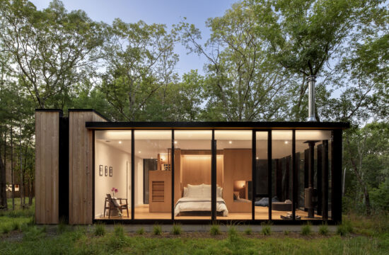 VIA43 Bunkhouse is a glass guesthouse with a central bunk volume for visitors