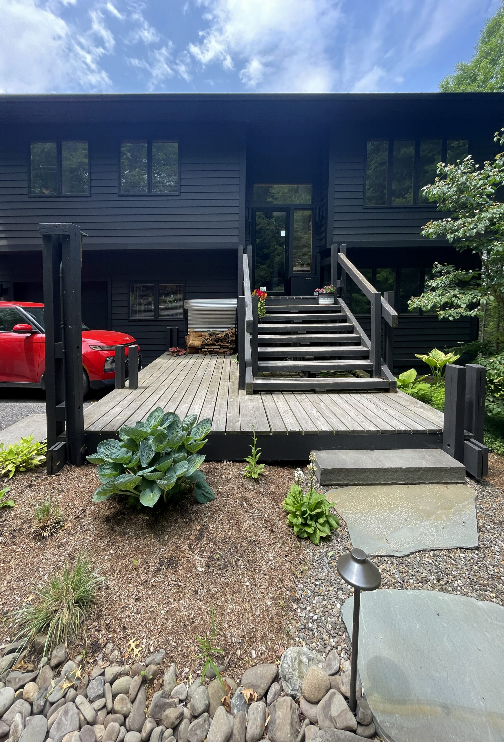 The exisitng entry at Woodland Pop House included a split level entry accessed by a large, cumbersome staircase and platform decking.