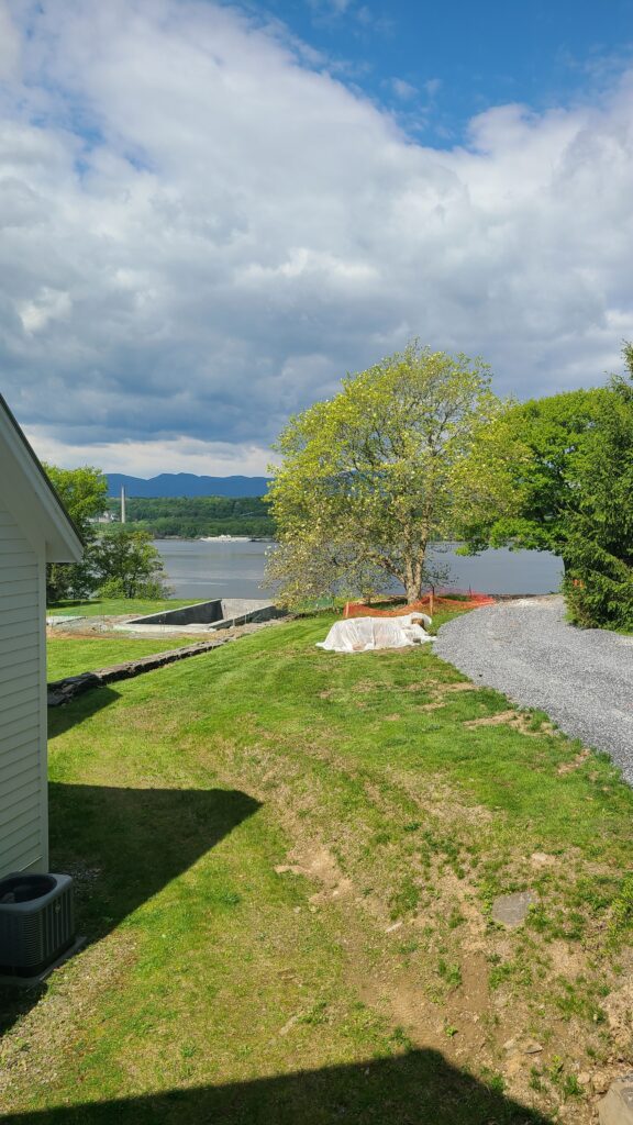 Exterior of Queensbury Reno residence during bidding and permitting phase, with permit recently submitted and material selections being finalized.