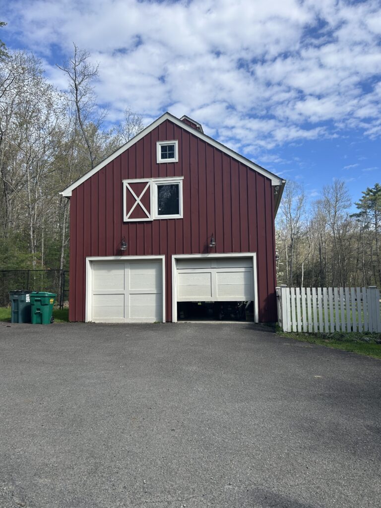 Existing garage space at Red Barn Reno, showing the raw structure that will be transformed into a shared client office space with guest quarters above.