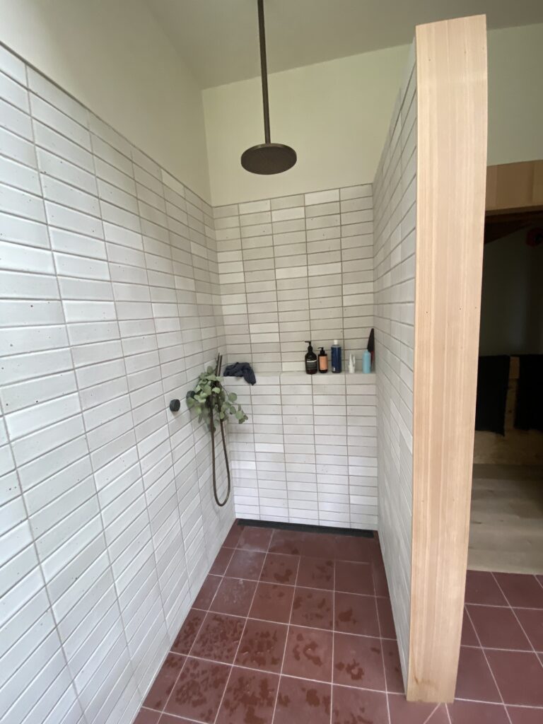Bathroom finishes installed at Mt Tremper Cottage, showing tile and fixture work nearing completion in this carefully detailed renovation.