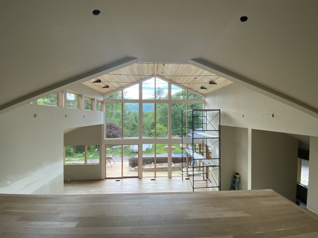 Ceiling and rafter tie work completed at Pond Lane, showcasing the structural detail and craftsmanship of this renovation's upper volumes.