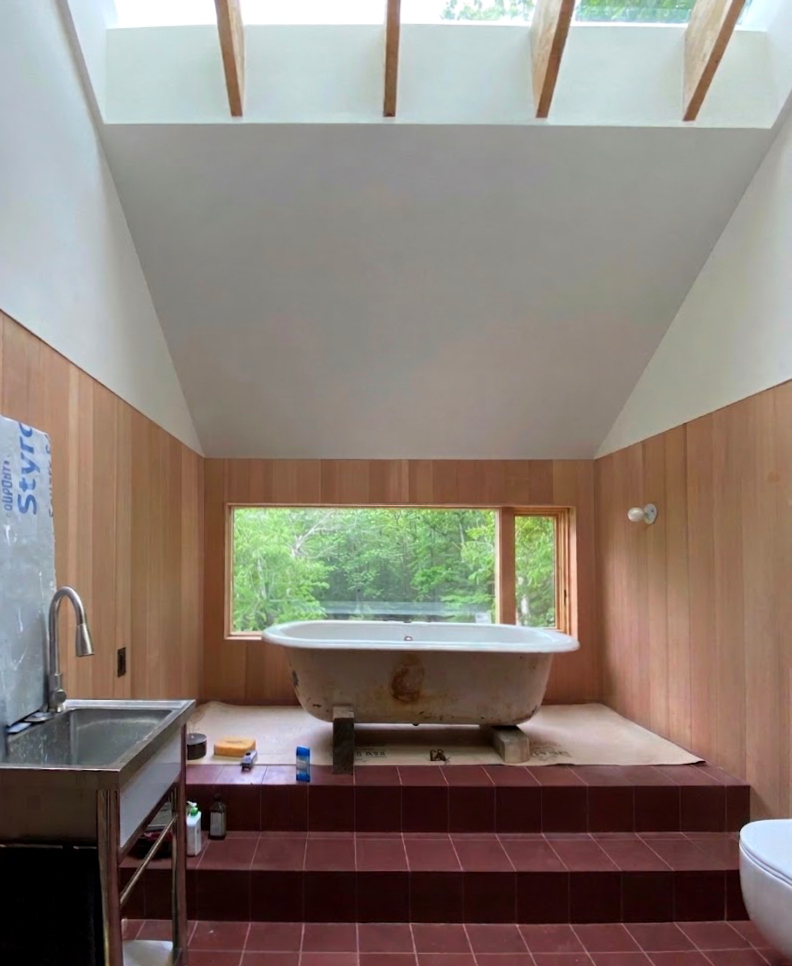 Detail of bathroom finish installation at Mt Tremper Cottage, with clean tile work and fixtures in place during the final construction phase.