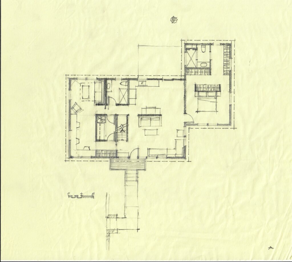 Hand-drawn pencil floor plan on yellow trace paper showing a compact rectangular ground-level layout with bedrooms, bathroom, and deck